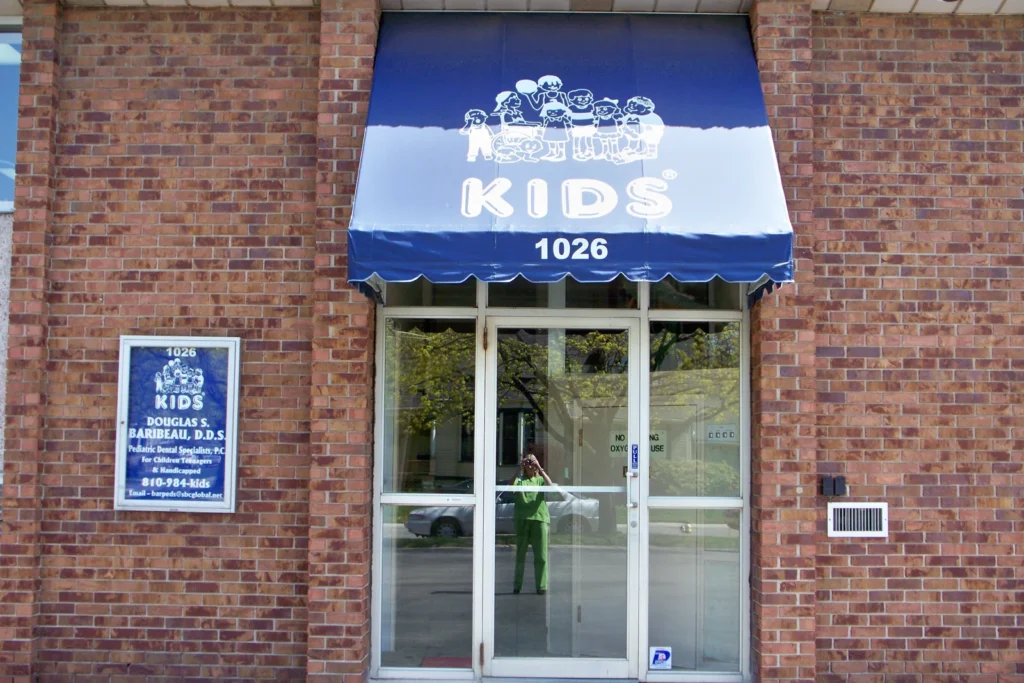 The practice building at 1026 Superior Street in Port Huron, with its blue KIDS awning